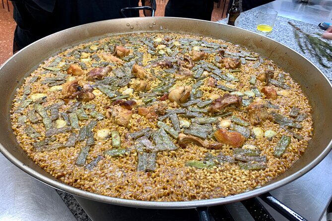 Valencian paella cooking class, tapas and visit to Ruzafa market. - What the Reviews Reveal